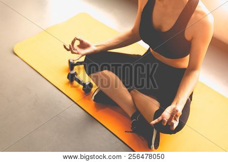 Top View Woman Doing Finger Trigger Yoga Or Pay Obeisance In Fitness Workouts Training Gym Center.  