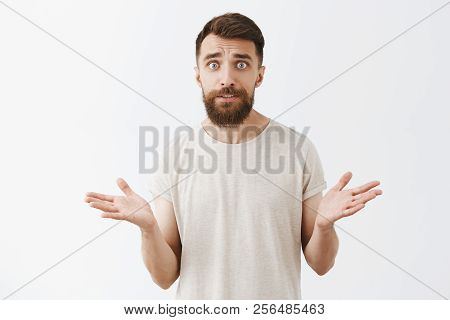 Man Cannot Understand How Wife Spent All Money. Confused Concerned Good-looking Mature Husband With 
