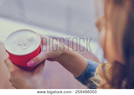 Concept Of Having A Cup Of Coffee In The Morning. Young Lady Is Gossiping With Her Best Friend In A 