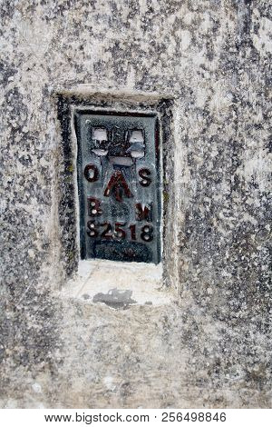 The Ordnance Survey Bench Mark On The Side Of A British Triangulation Point, Or Trig Point