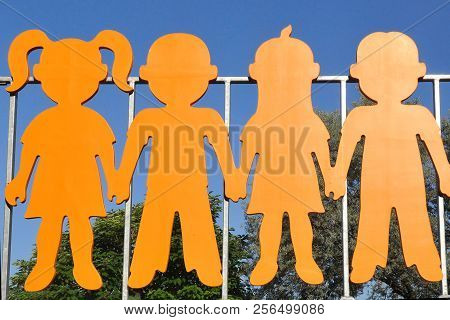 Colored Wooden Children, Symbol Of Peace, Art Object In The Park.