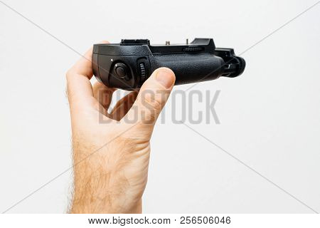Photographer Hand Holding Against White Background A New Modern Battery Camera Grip For His New Came