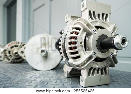 Close Up Of Car Alternator On Display On Metal Shelf/auto Parts