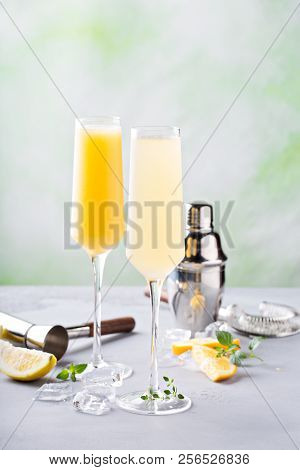 Breakfast Mimosa Cocktails In Flute Glasses On Light Background