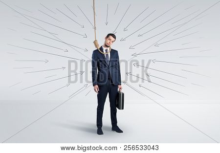 Hopeless young businessman trying to suicide with question signs concept