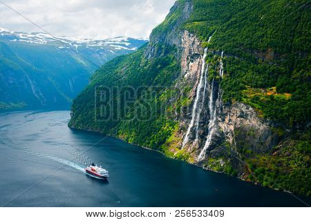 Breathtaking view of Sunnylvsfjorden fjord and famous Seven Sisters waterfalls, near Geiranger village in western Norway.