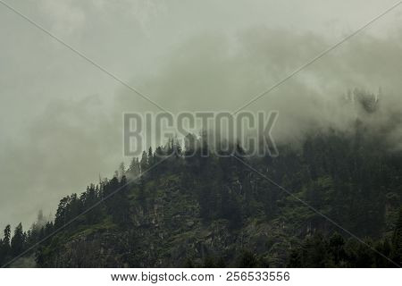 Heavy Cloud In The Rocks Mountains With Forest