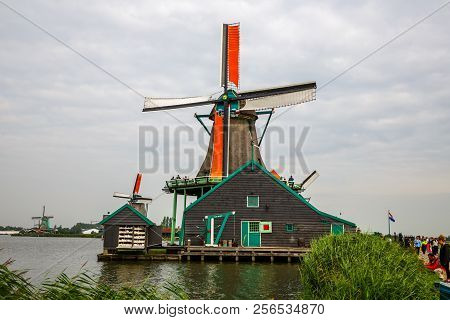Zaanse Schans, Netherlands, August 19, 2015 - Traditional, Authentic Dutch Windmills At The River Za