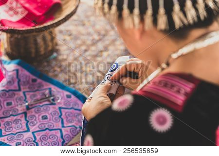 Asian Hill Tribe Sewing Artistic Traditional Identity Pattern On Her Clothes