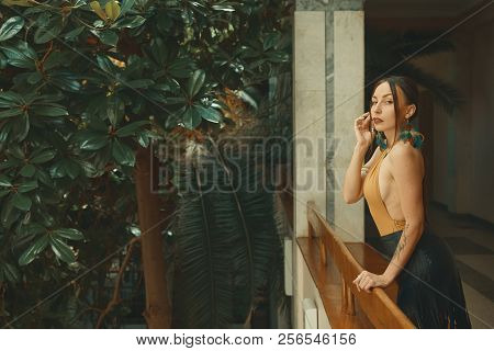 Pretty Young Woman Standing In Hotel Balcony, Looking Out Enjoyi