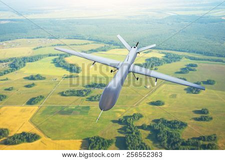 Patrolling Unmanned Aircraft In The Sky Above The Terrain, Fly Tracking.