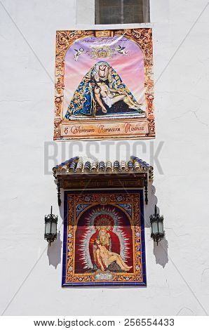 Ayamonte, Spain - June 11, 2017 - Religious Pictures On The Front Of The Las Angustias Parish Church