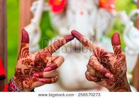 Sanga, Nepal - July 16, 2018 : Image Of Henna Painted Women Hands In Sanga, Nepal. Two Women Keeping
