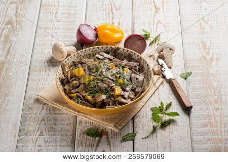 pizzocheri pasta with mushroom pepper and mint leaves