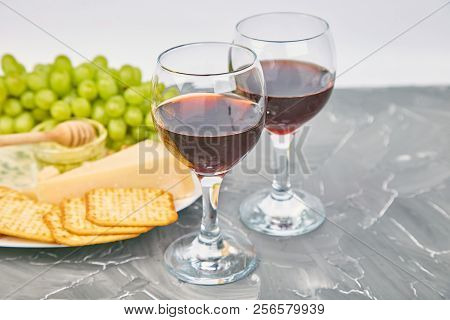 Cheese Plate Variety, And Wine In Glasses