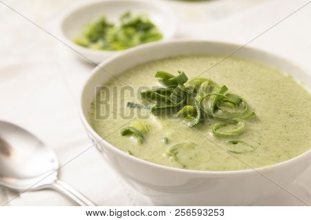 Leek Cream Soup In A Bowl On A White Tablecloth, Selected Focus, Narrow Depth Of Field