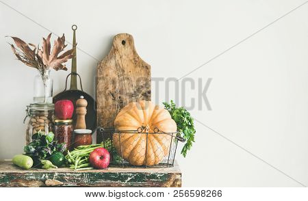 Autumn Food Ingredients And Utensils Over Wooden Cupboard Chest