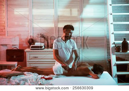 Back Massage. Sexy Man Masseur. Massage Oils And Scented Body Oil. Massage Therapy For Health Purpos