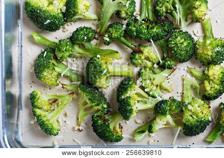 Roasted Broccoli Florets With Cheese On A Baking Tray