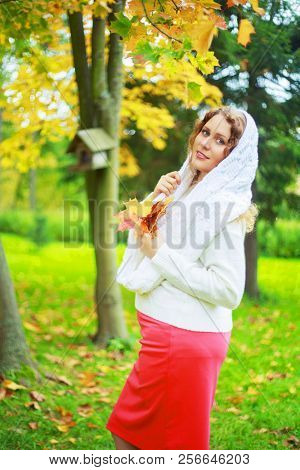 beautiful young plussize model   in the autumn park