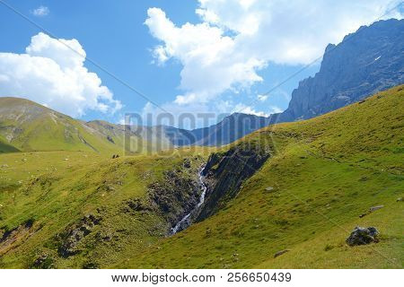 Grand Alpine Mountain Range With Waterfall During Summer On A Hiking Trail Leading From Juta To Chau
