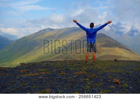 Views On Chaukhi Mountain Pass Witha Young Man On A Hiking Trail From Abudelauri Lakes To Juta In Ca