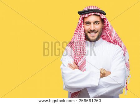 Young handsome man wearing keffiyeh over isolated background happy face smiling with crossed arms looking at the camera. Positive person.