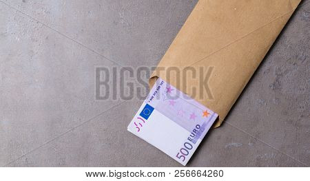 Euro In Beige Envelope, Isolated On A Grey Background