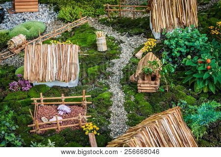 Miniature Rural Landscape, Toy Village With Small Wooden Hoses And Farm In Countryside, Little World