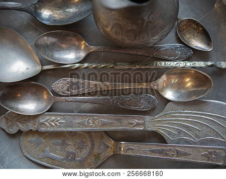 Top Shot Of Silverware Utensil On Silver Tray
