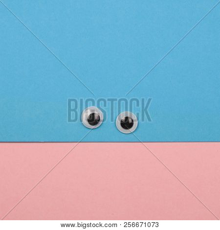 Creative Minimal Paper Smile Face With Plastic Toy Eyes Pastel Colors Flat Lay Square