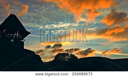 A Castle Against A Pink And Mauve Sunset Sky Nevytsky Castle At Ukraine, Zakarpattia Oblast