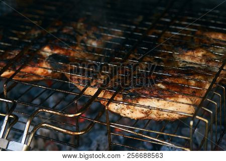 Grilled Chicken Tabaka On The Flaming Grill