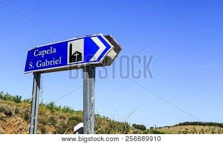 Street Sign Post On The Side Of The Road Indicating The Direction To The Chapel Of St Gabriel, Near 
