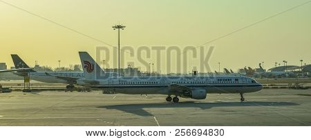 Passenger Airplane Docking At The Airport