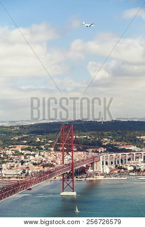 The 25 De Abril Steel Suspention Bridge In Lisbon