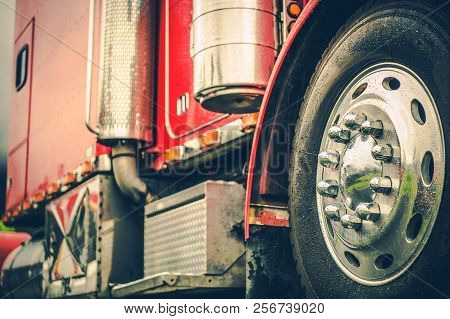 Classic Red Semi Truck Closeup Photo. Trucking Theme. Cargo And Shipping Industry.