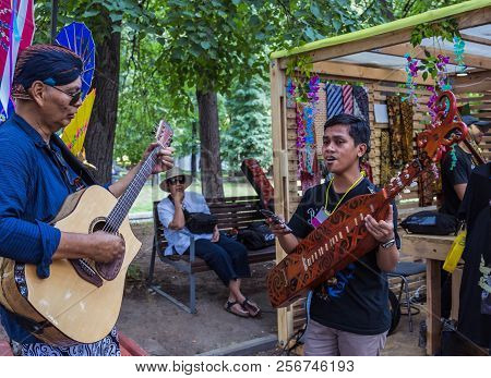 Moscow, Park On Krasnaya Presnya, August 05, 2018: Two Musicians From Indonesia With Folk Instrument