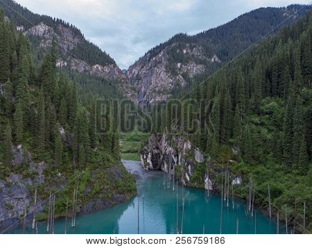 Kaindy Lake In Kazakhstan Known Also As Birch Tree Lake Or Underwater Forest. Is A 400 Meter Long La