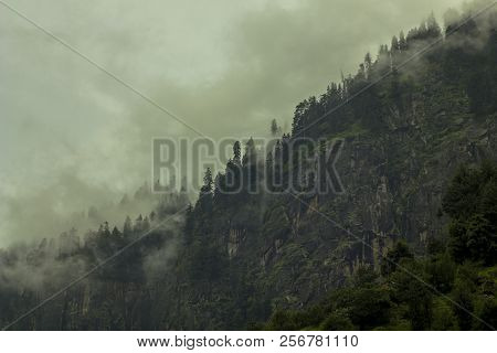 Heavy Cloud And Fog On The Rock
