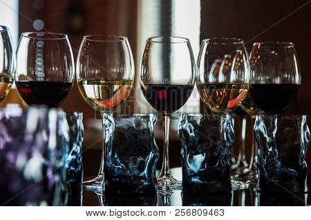 Glasses With Alcoholic Drinks In A Restaurant