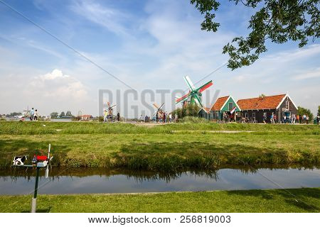 Zaanse Schans, Netherlands, August 19, 2015 - Traditional, Authentic Dutch Windmills At The River Za