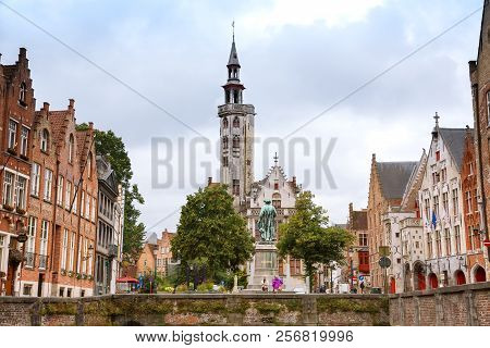 Bruges, Belgium-august 15, 2015-tower Of Poortersloge, Aka Burghers Lodge And The Medieval Houses At