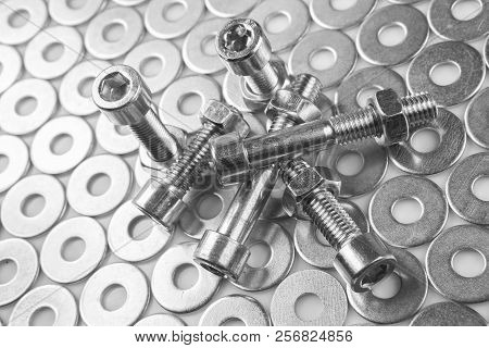 Chromeplated Bolts And Nuts On White Background