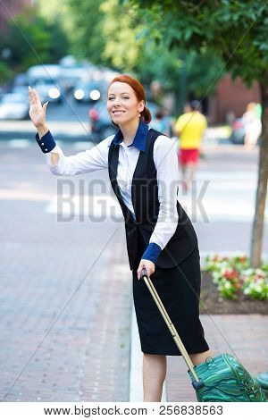 Portrait Pretty Young Business Woman With Travel Bag, Luggage, Hails Taxi Cab In The City, Washingto