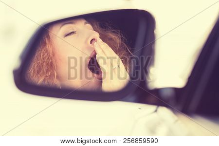 Side View Mirror View Reflection Sleepy Tired Fatigued Yawning Exhausted Young Woman Driving Her Car