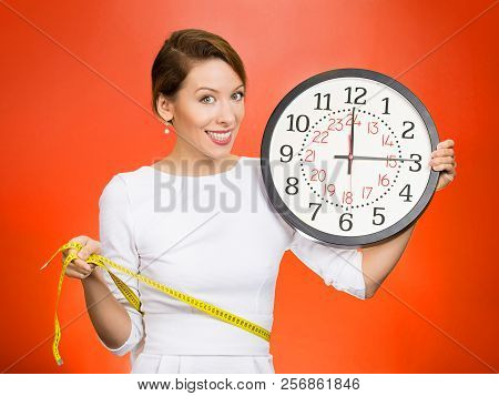 On Time Great Fitness Result. Portrait Young Attractive Happy Fit Woman Holding Clock, Measuring Her