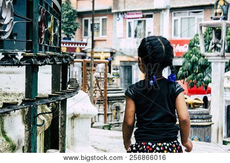 Kathmandu Nepal August 24, 2018 View Of A Nepali Child Playing Around The Shree Gha Stupa Temple Loc