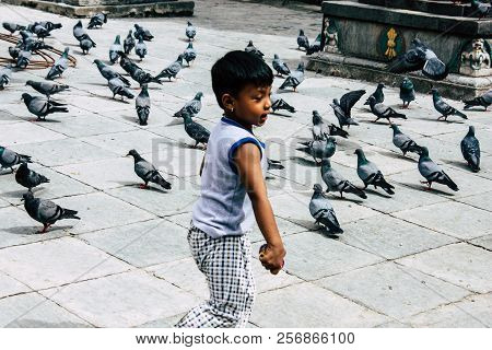 Kathmandu Nepal August 24, 2018 View Of A Nepali Child Playing Around The Shree Gha Stupa Temple Loc
