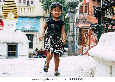 Kathmandu Nepal August 24, 2018 View Of A Nepali Child Playing Around The Shree Gha Stupa Temple Loc